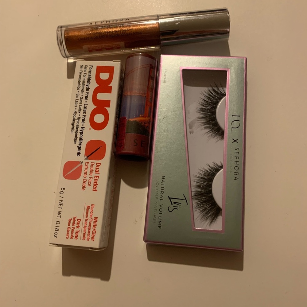 NWT 4-piece makeup set: lashes, brush lash adhesive lipstick, and eye shadow
